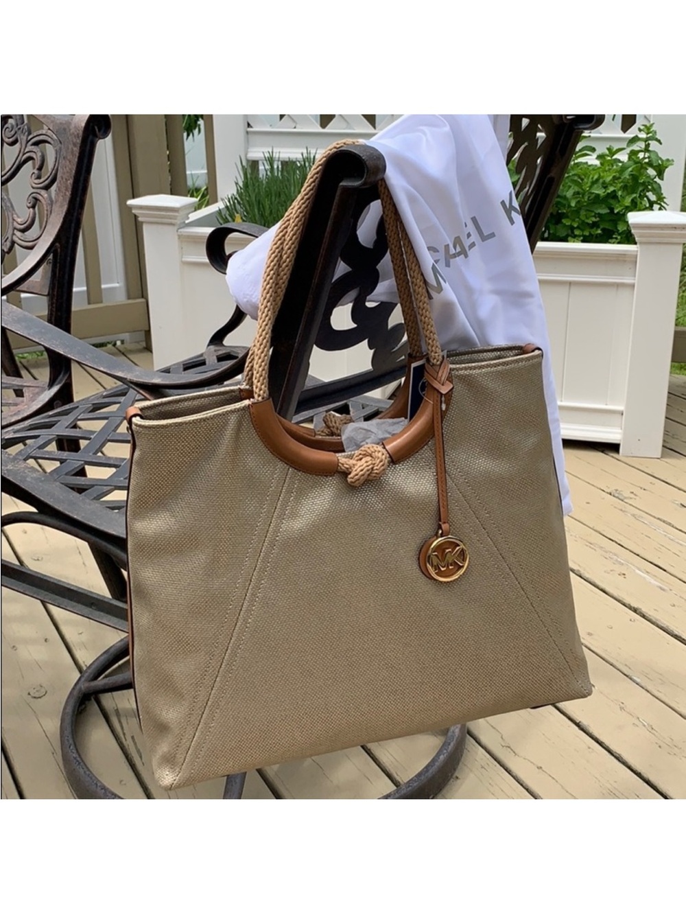 Michael Kors Isla Canvas Tote with Brown Trim and Rope Handles.
